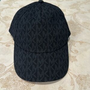 Woman’s black baseball cap